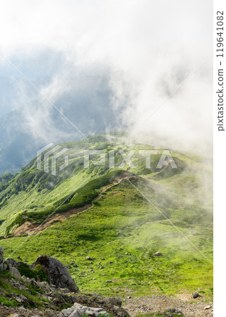 Looking down on the winding road from Mount Mitsumatarenge. Hiking Mount Kurobegoro in the Northern Alps. 119641082