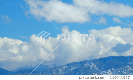 Beautiful Blue Sky And Delicate White Opposite Direction Clouds. Forming Clouds In Front Of A Snowy Mountain Landscape. Timelapse. 119641937