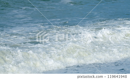 Calm On The Sea. Amazing Rolling Foamy Sea Wave Sparkling In Sun Washes Round Wet Pebbles. Still. Calm On The Sea. Amazing Rolling Foamy Sea Wave Sparkling In Sun Washes Round Wet Pebbles. Still. 119641948