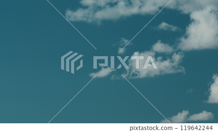 Soft White Cumulus Clouds Move In Blue Sky. Beautiful Nature. Natural Background. Soft White Cumulus Clouds Move In Blue Sky. Beautiful Nature. Natural Background. 119642244