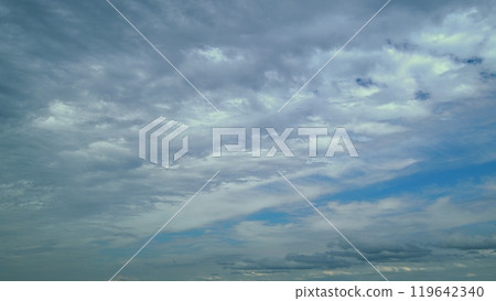Tropical Summer Sunlight. Various Layers Of Clouds Move In Different Directions At Altitude. Tropical Summer Sunlight. Various Layers Of Clouds Move In Different Directions At Altitude. 119642340