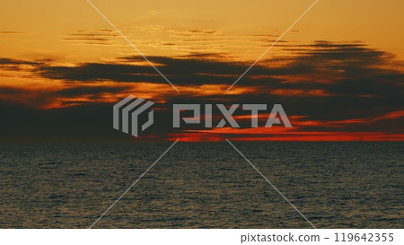 Golden Glare On Water Abstract Background. Sunset At Sea. Ocean Colors Sky And Waves In Red Color. Still. Golden Glare On Water Abstract Background. Sunset At Sea. Ocean Colors Sky And Waves In Red Color. Still. 119642355