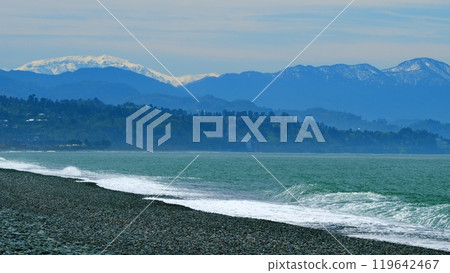 Sea In Pastel Colors. In Haze Can See Mountains And City Buildings. Slow motion. Sea In Pastel Colors. In Haze Can See Mountains And City Buildings. Slow motion. 119642467