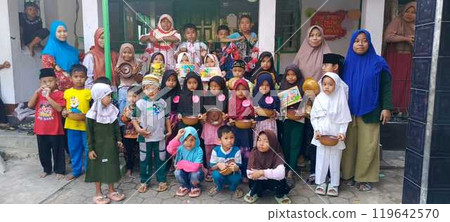 group of happy elementary pupils reading group of happy elementary pupils reading 119642570