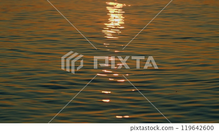 Beautiful Sunset Above Sea. Sunrays Flickering In Ripples On Water Surface. Natural Sky Reflects In Sea Warm Colors. Slow motion. Beautiful Sunset Above Sea. Sunrays Flickering In Ripples On Water Surface. Natural Sky Reflects In Sea Warm Colors. Slow motion. 119642600