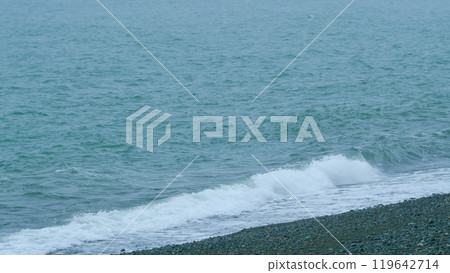 Calm Turquoise Water Hitting Sandy Beach On Seashore. Sea Waves Run On Shore Of Sea Or Ocean. Slow motion. Calm Turquoise Water Hitting Sandy Beach On Seashore. Sea Waves Run On Shore Of Sea Or Ocean. Slow motion. 119642714