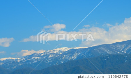 White Clouds Float Across The Blue Sky. Mountain Revealed Behind Fir Tree Forest. Timelapse. 119642778