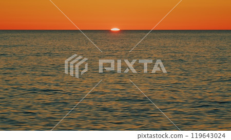 Sun Reflecting On Sparkling Blue Sea In Summer. Beautiful Sea Background With Sky Reflects In Sea For Summer Travel Concept. Slow motion. Sun Reflecting On Sparkling Blue Sea In Summer. Beautiful Sea Background With Sky Reflects In Sea For Summer Travel Concept. Slow motion. 119643024