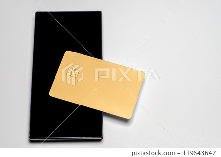 Plain gold credit card and smartphone 119643647