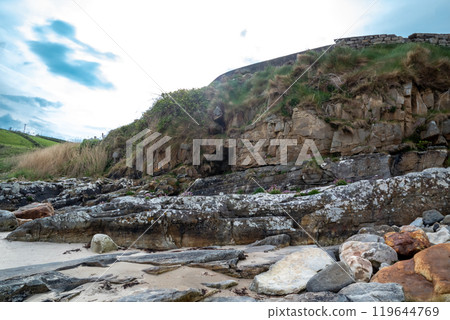 The beautiful stone layers at Muckross Head beach, County Donegal, Ireland. 119644769
