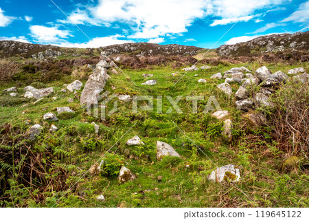 The beautiful rocks next to the scenic coastal single track road between Meenacross and Crohy Head south of Dungloe, County Donegal - Ireland 119645122