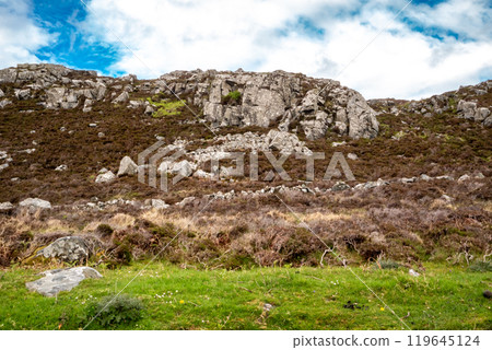 The beautiful rocks next to the scenic coastal single track road between Meenacross and Crohy Head south of Dungloe, County Donegal - Ireland 119645124
