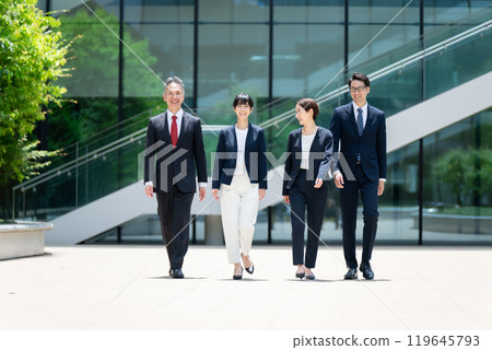Business person walking outdoors Business person walking outdoors 119645793