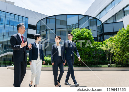 Business person walking outdoors 119645863