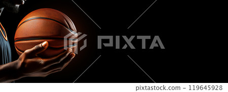Hand of a Basketball Player Holding a Basketball Ball Isolated on Black Background - Generative Ai 119645928