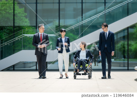 Business wheelchair team walking Business wheelchair team walking 119646084