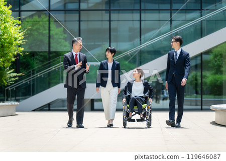 Business wheelchair team walking Business wheelchair team walking 119646087
