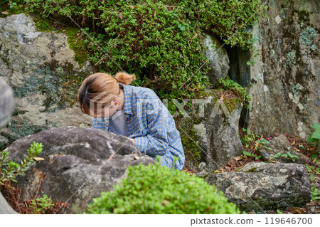 Woman taking care of the garden, Japanese garden, countryside, vacant house, weeding Woman taking care of the garden, Japanese garden, countryside, vacant house, weeding 119646700