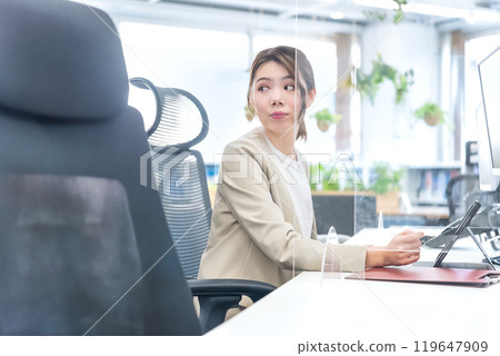 A woman working in a free address office A woman working in a free address office 119647909