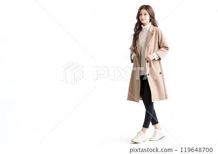 A woman walking in a beige coat 119648700