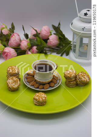Elegant Coffee Setup with Cookies and Almonds 119650178