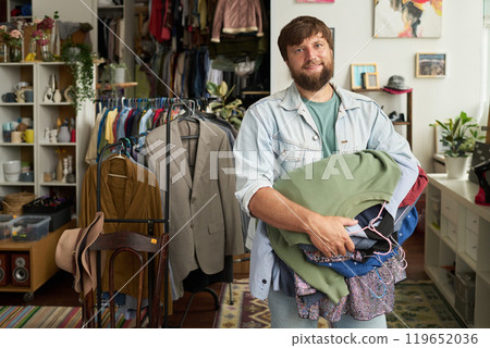 Happy young customer of thrift shop 119652036