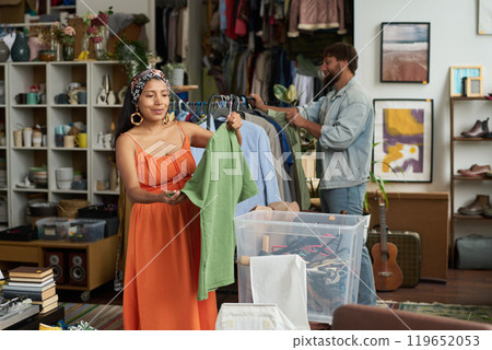 Young smiling woman with green blouse 119652053