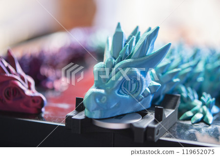 Beautiful creative multi-colored object printed on a 3D printer from melted colored plastic. Artistic model printed by 3D printer from multi-colored plastic. Modern additive 3d printing technologies 119652075