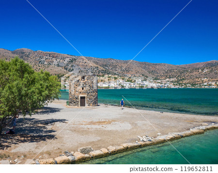 Ruins of an old windmill on the Greek coast (Elounda, Crete) 119652811