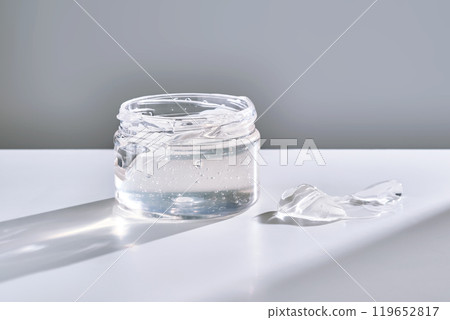Texture of the gel in the jar. Hair gel or hyaluronic gel for the face. Texture of the gel in the jar. Hair gel or hyaluronic gel for the face. 119652817