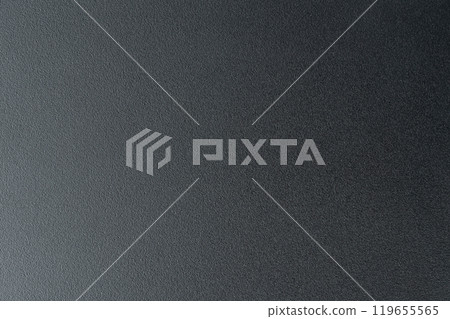 Close-up of smooth black surface under soft lighting 119655565