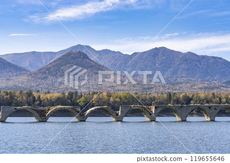 Taushubetsu River Bridge on the former Shihoro Line of the Japanese National Railways on a clear autumn day in Kamishihoro, Hokkaido Taushubetsu River Bridge on the former Shihoro Line of the Japanese National Railways on a clear autumn day in Kamishihoro, Hokkaido 119655646