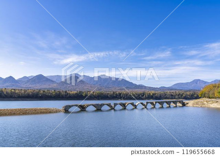 Taushubetsu River Bridge on the former Shihoro Line of the Japanese National Railways on a clear autumn day in Kamishihoro, Hokkaido Taushubetsu River Bridge on the former Shihoro Line of the Japanese National Railways on a clear autumn day in Kamishihoro, Hokkaido 119655668