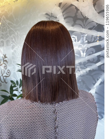 woman blowing her hair woman blowing her hair 119655986