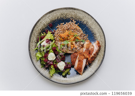 Hearty buckwheat with grilled chicken and beetroot salad, a wholesome and nutritious dish 119656039