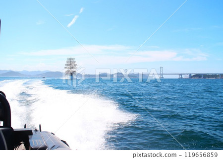 Pleasure boat in the Naruto Strait and the Onaruto Bridge 119656859