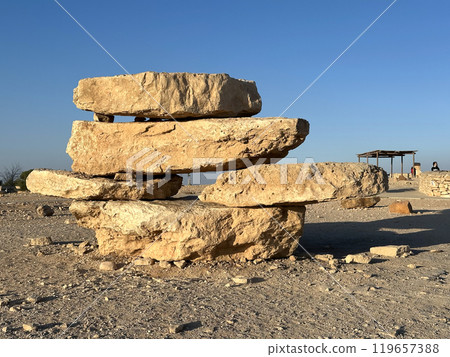 Pyramid of stones on the promenade above the erosion crater Makhtesh Ramon Pyramid of stones on the promenade above the erosion crater Makhtesh Ramon 119657388