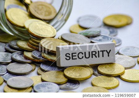 Security text on white wooden block with coins and jar background. Life security concept 119659007