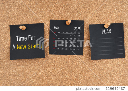 May 2025 calendar with Time for a new start and Plan text on black adhesive notes. 119659487