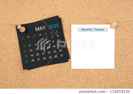 Calendar sheet for May 2025 and blank adhesive notes for monthly planner with thumbtack on wooden. 119659530