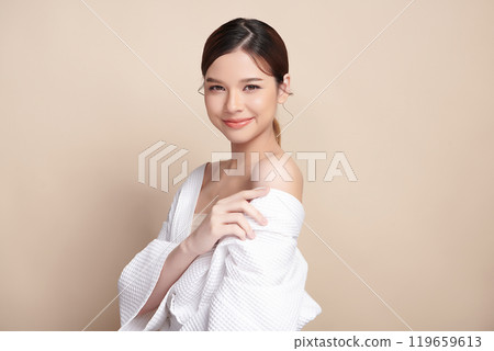 Beautiful young asian woman with clean fresh skin on beige background, Face care, Facial treatment, Cosmetology, beauty and spa, Asian women portrait. 119659613
