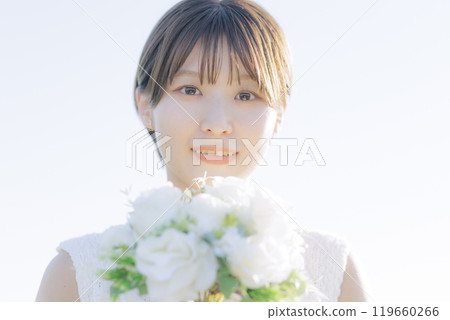 A woman holding a bouquet A woman holding a bouquet 119660266