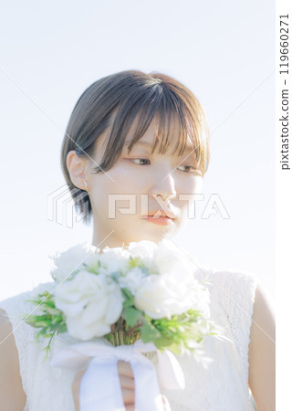 A woman holding a bouquet A woman holding a bouquet 119660271