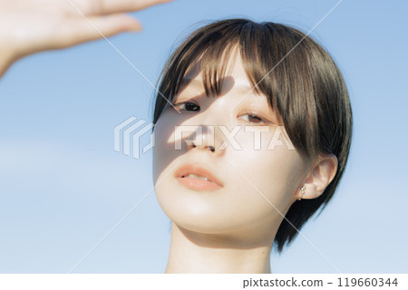 A young woman staring 119660344