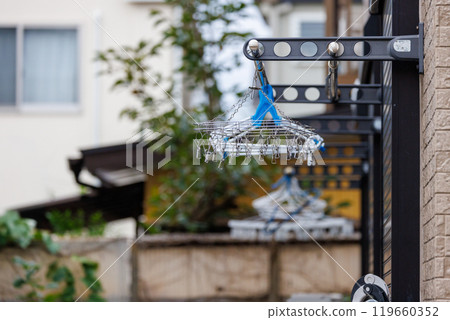 Hanger hanging on a clothesline 119660352