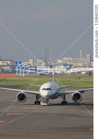 airliner being towed airliner being towed 119660385