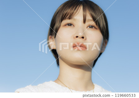 A young woman looking far away A young woman looking far away 119660533