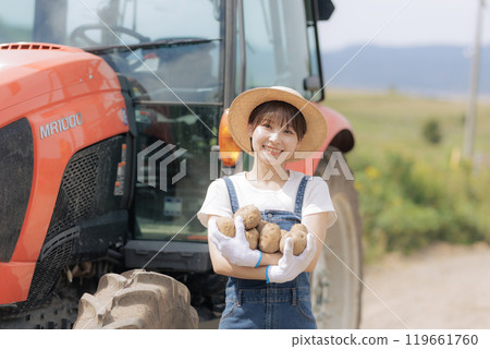 Young woman harvesting potatoes Young woman harvesting potatoes 119661760