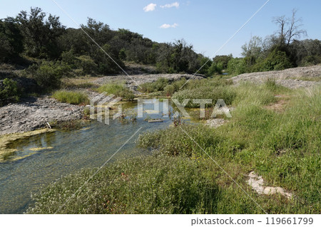Tranquil Stream in Rocky Landscape in Southern France Tranquil Stream in Rocky Landscape in Southern France 119661799