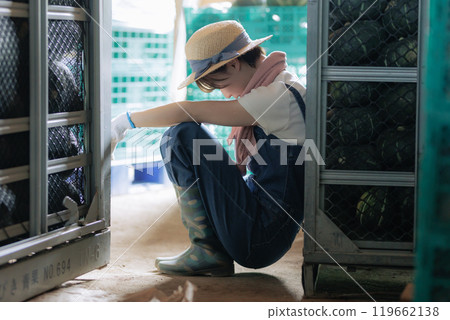 Young farmer woman taking a break Young farmer woman taking a break 119662138